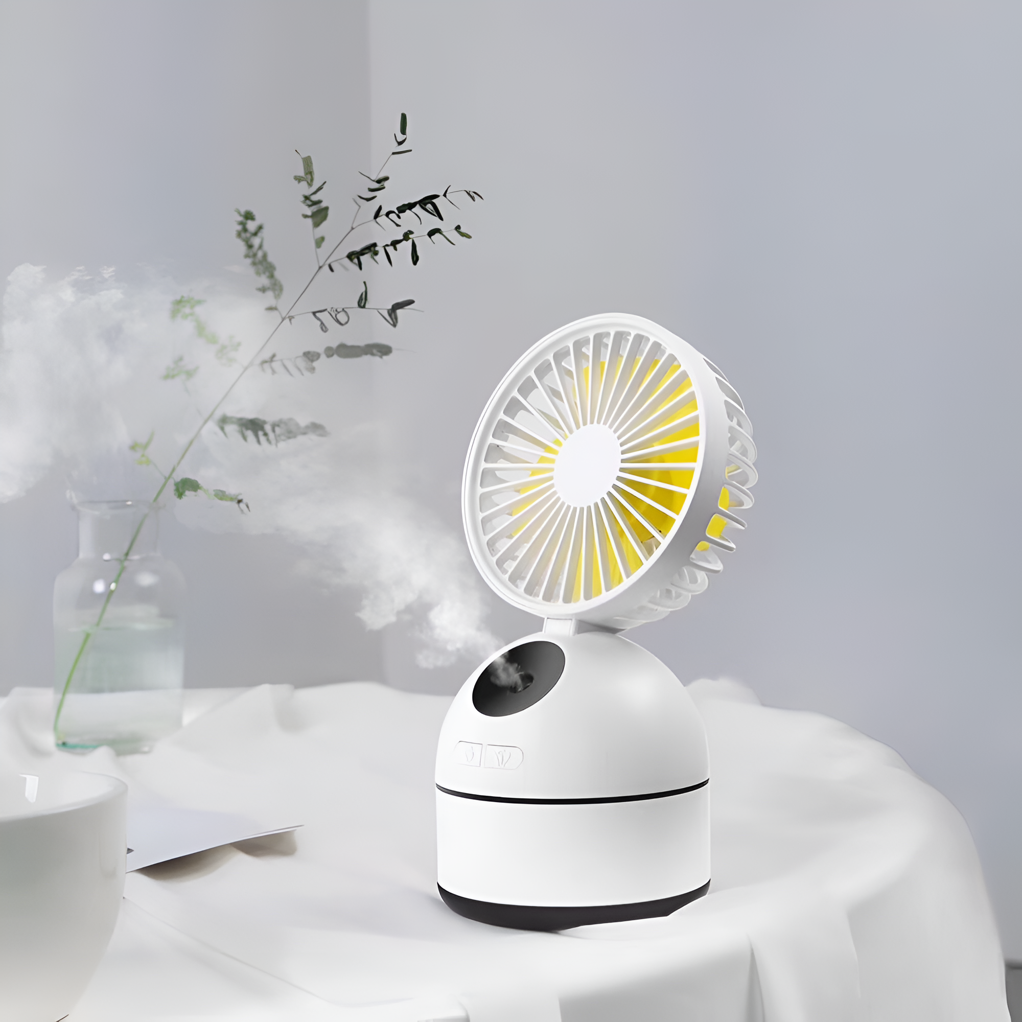 Portable fan on a white surface with a light gray background