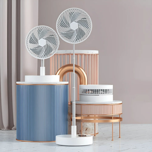 A modern minimalist scene with two white pedestal fans, the Glacient USB Attachable/Retractable Fan by CJDropshipping, and a portable mini fan on blue and copper accented stands, set against a light grey wall and white marble floor.